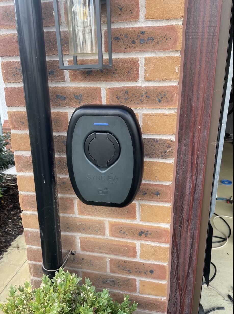 Sync EV EV charger installation in Cheshire by Evans Electrical Services — Sync EV home charging unit professionally wall-mounted